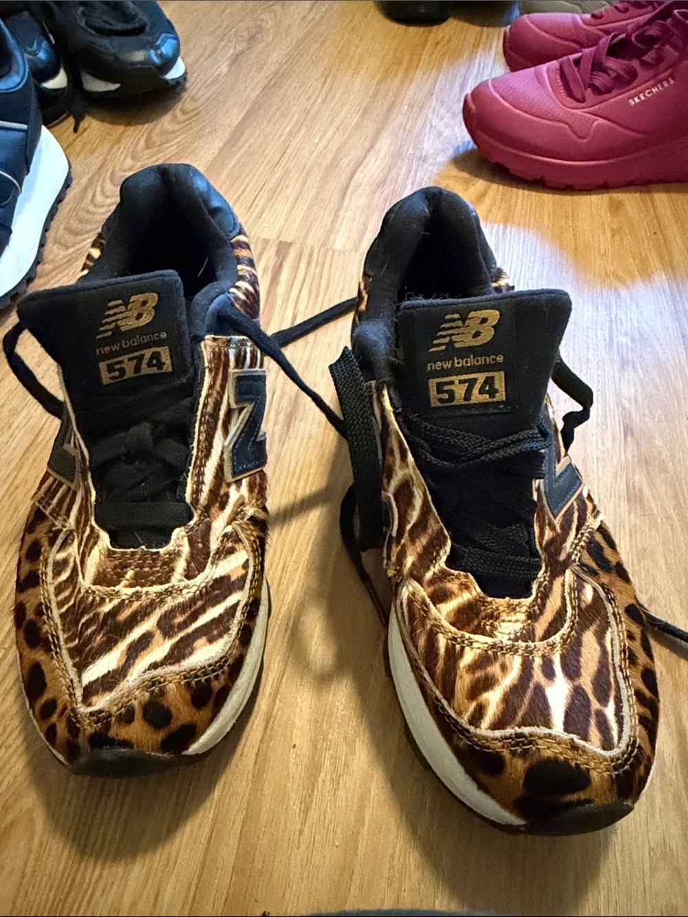 New Balance women’s Leopard-Print Sneakers in Brown and Black